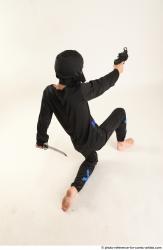 Man Young Athletic Fighting with gun Kneeling poses Casual Asian